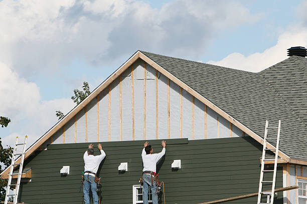 Professional Storm Damage Siding Repair technician working in Charlottesville, VA